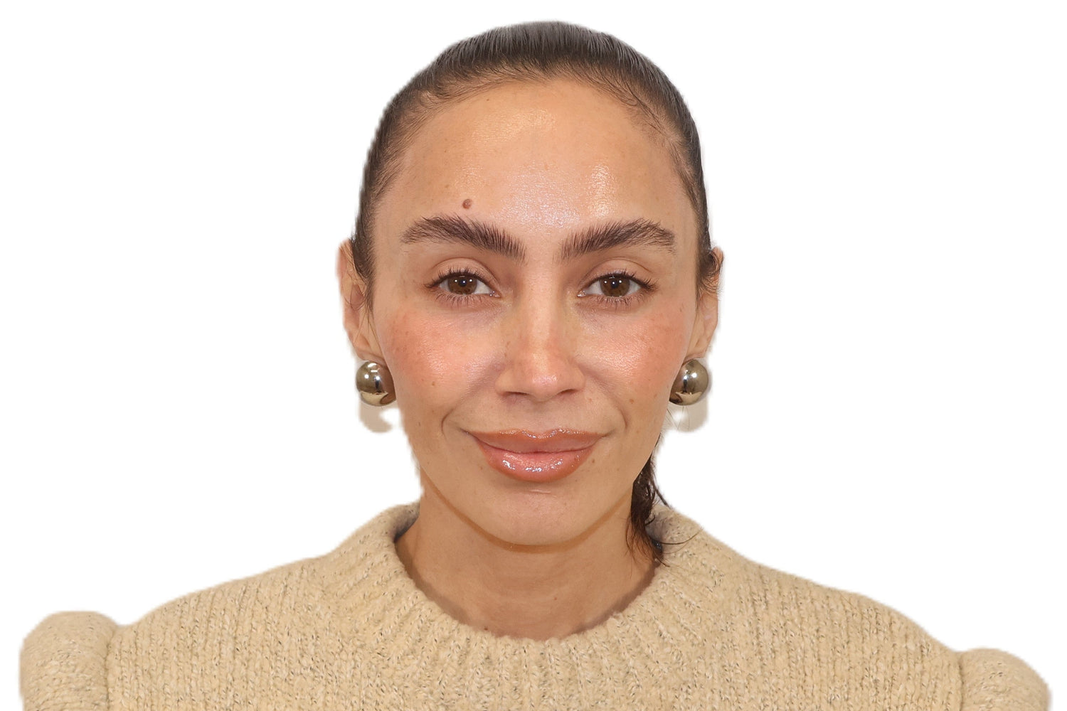 Woman wearing a beige sweater on a white background