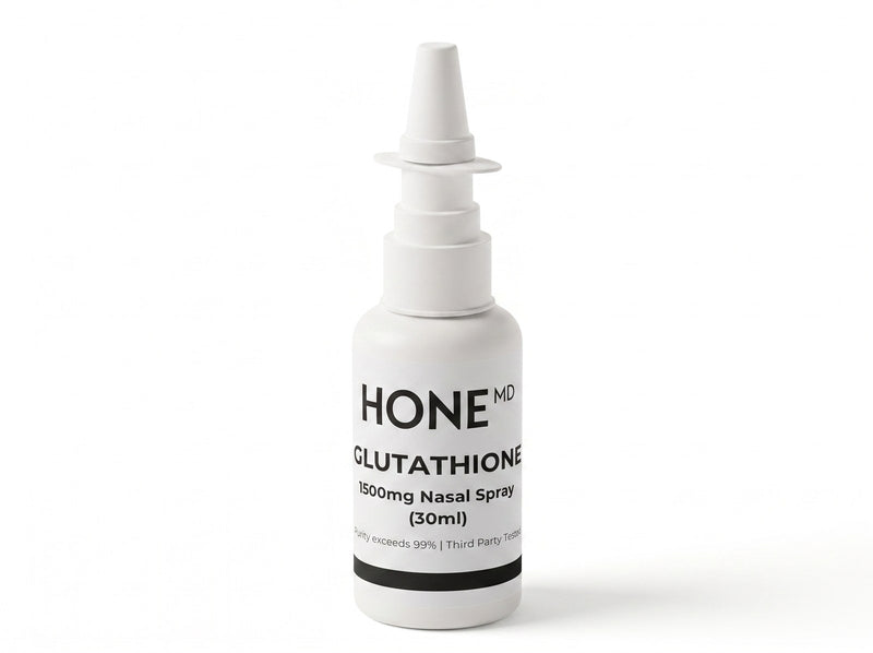 A white HoneMD glutathione nasal spray bottle, 1500 mg in 30 ml, standing on white