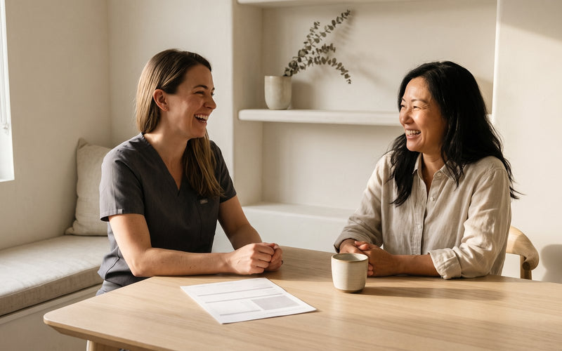 A client and her nurse practitioner laughing together at the ninety-day review, the protocol set aside